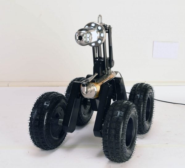 Robotic CCTV inspection crawler — studio reference shot.