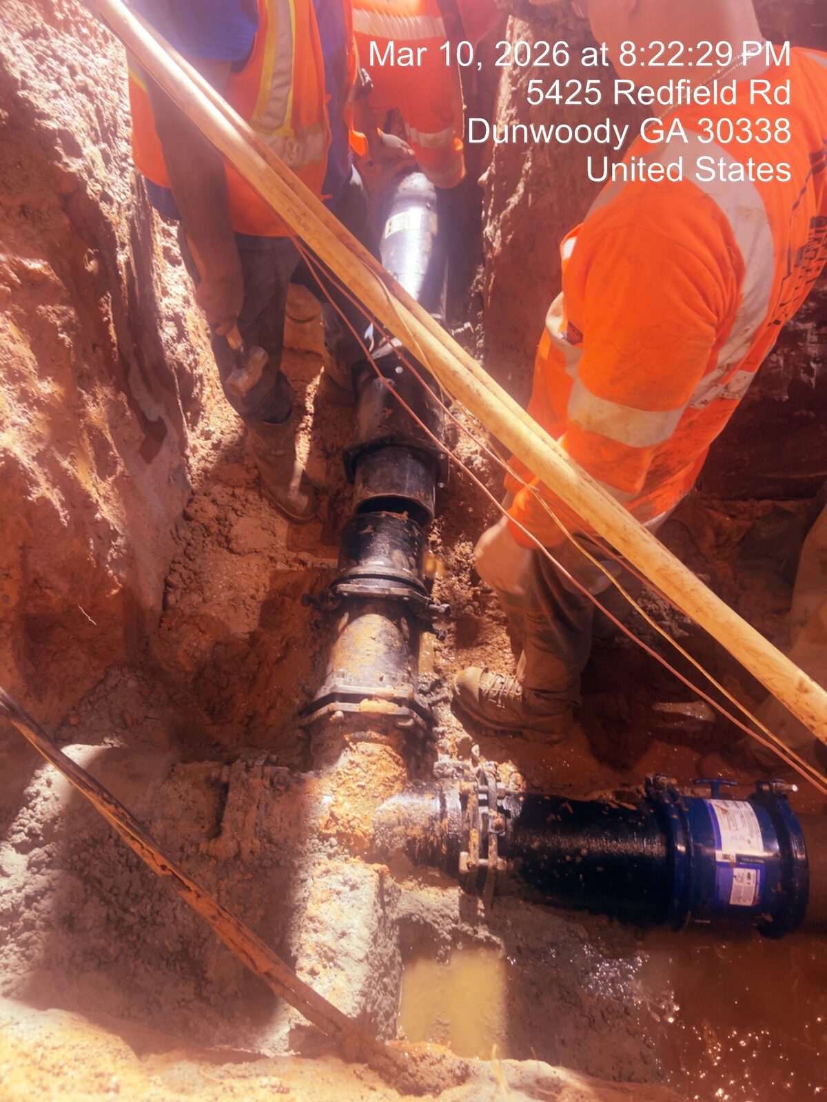 Water main interconnect — tying new line into existing distribution.