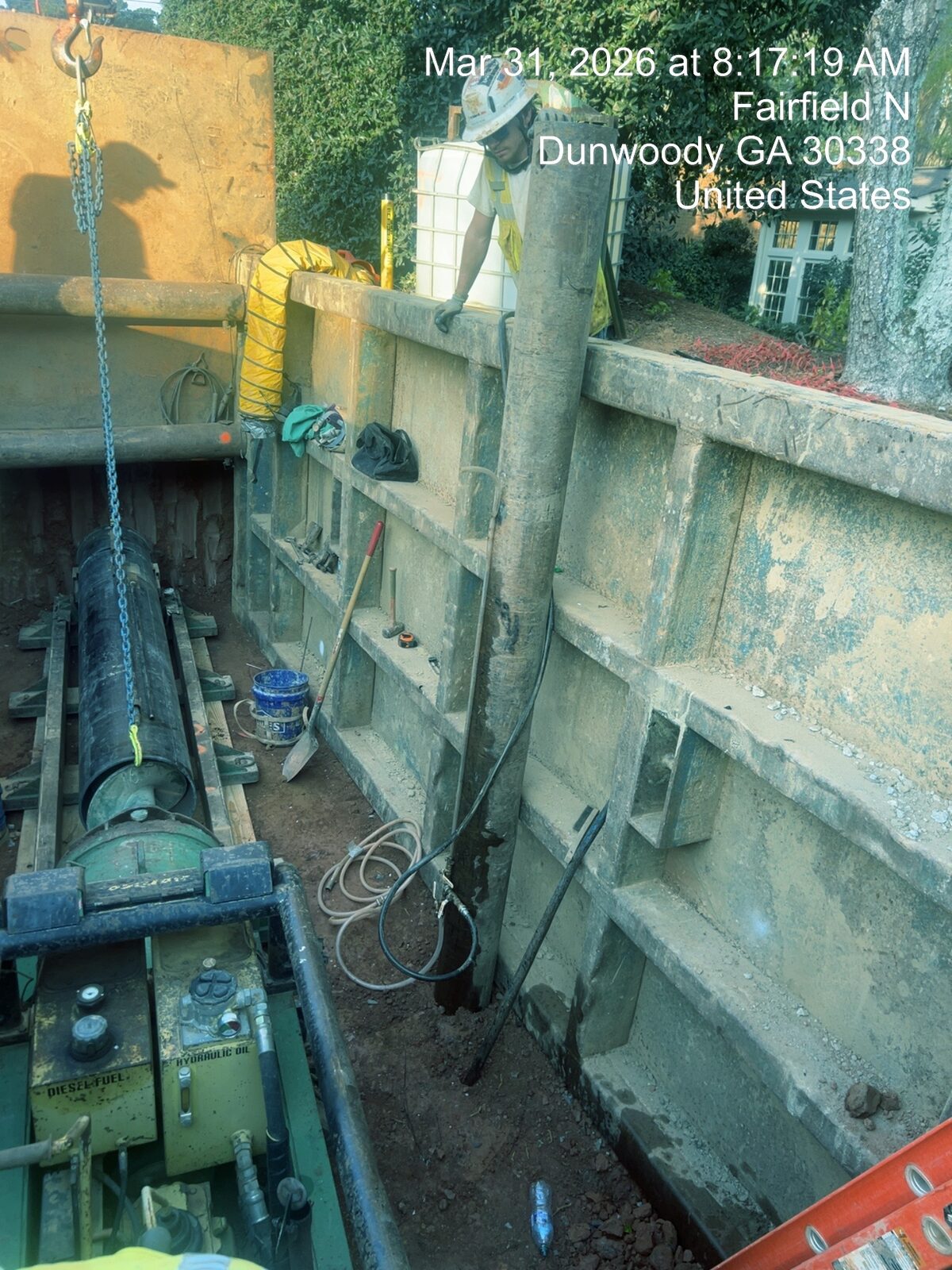 Jack-and-bore water main installation under roadway.